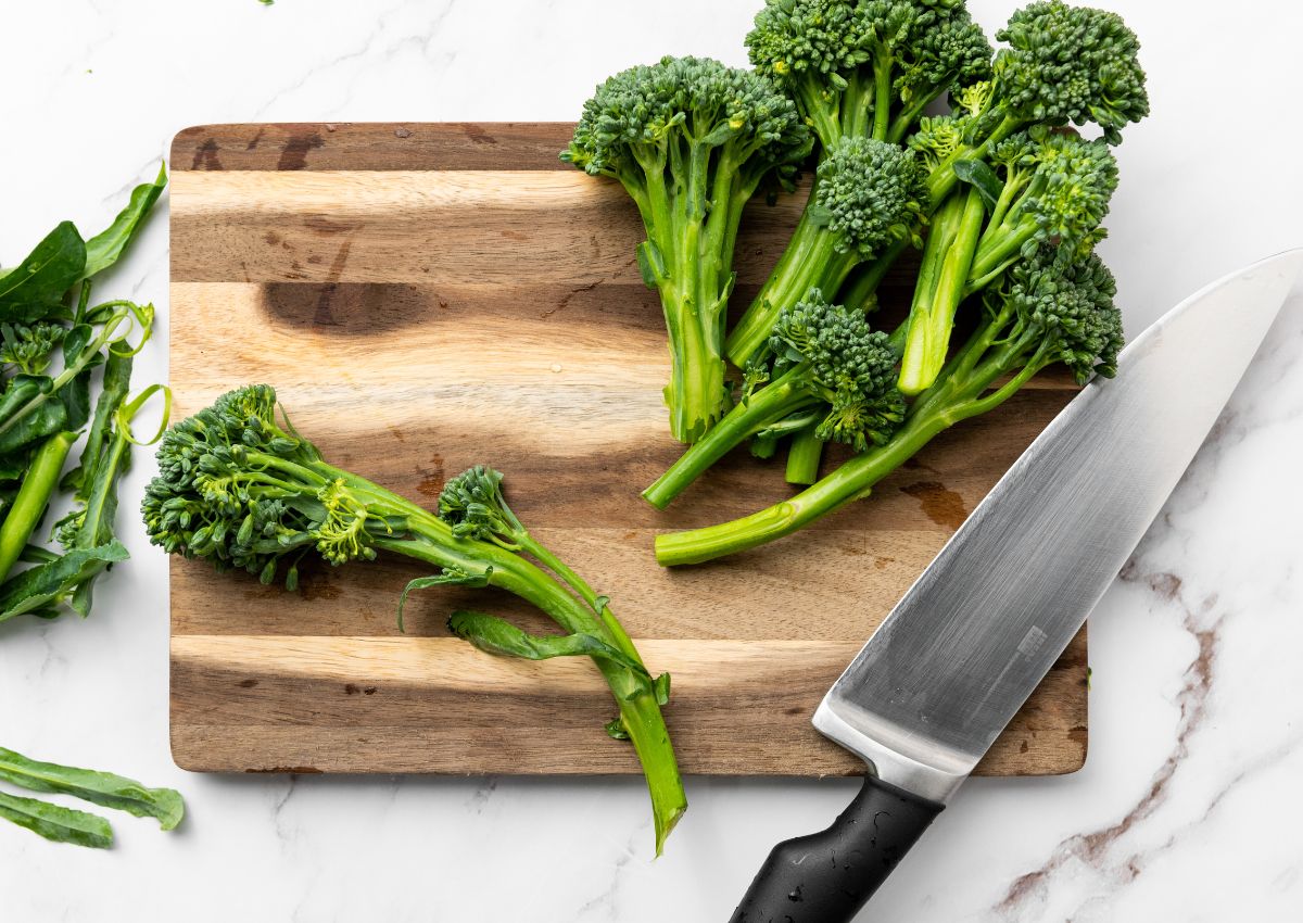 Broccolini on a cutting board