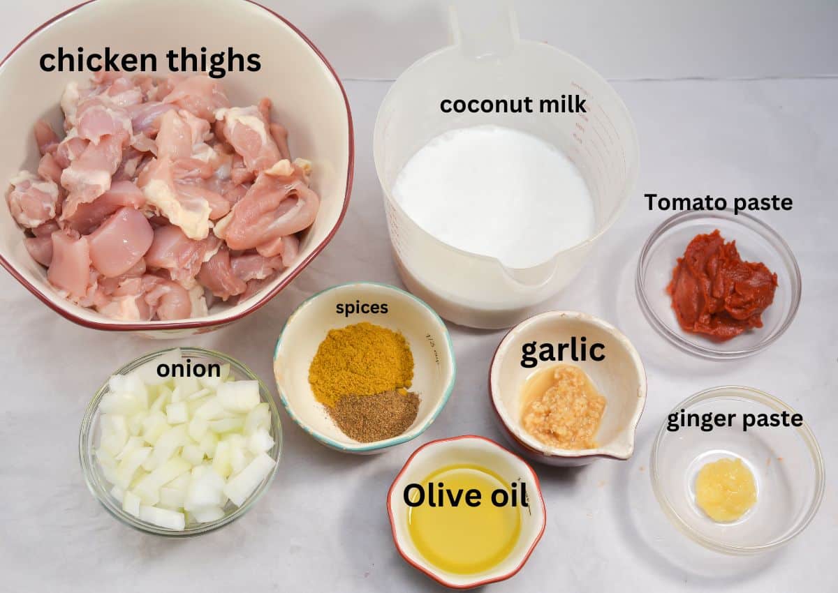 chicken thighs, coconut milk, Tomato paste, ginger paste, garlic, spices,oil, onion