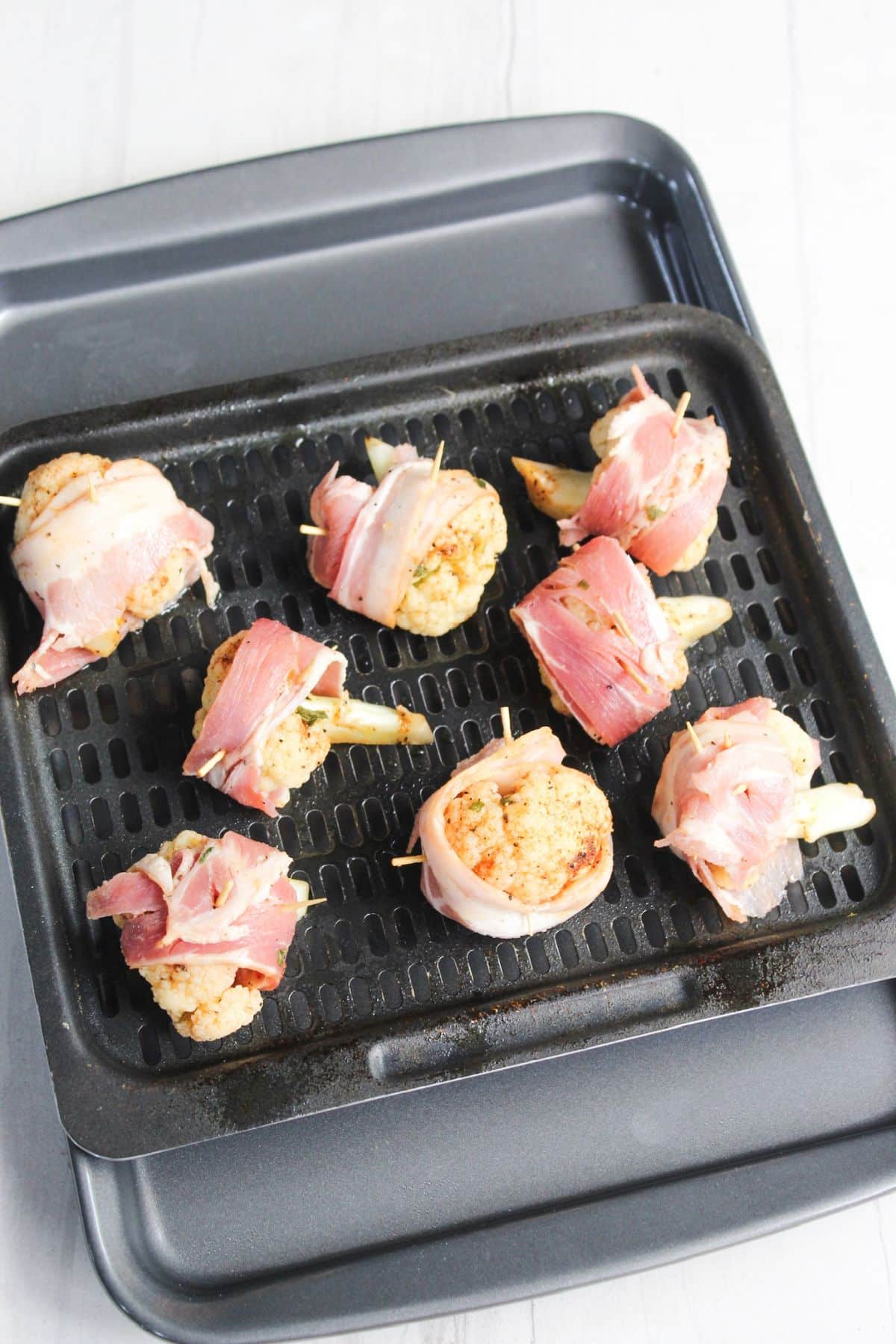 bacon wrapped on cauliflower on tray